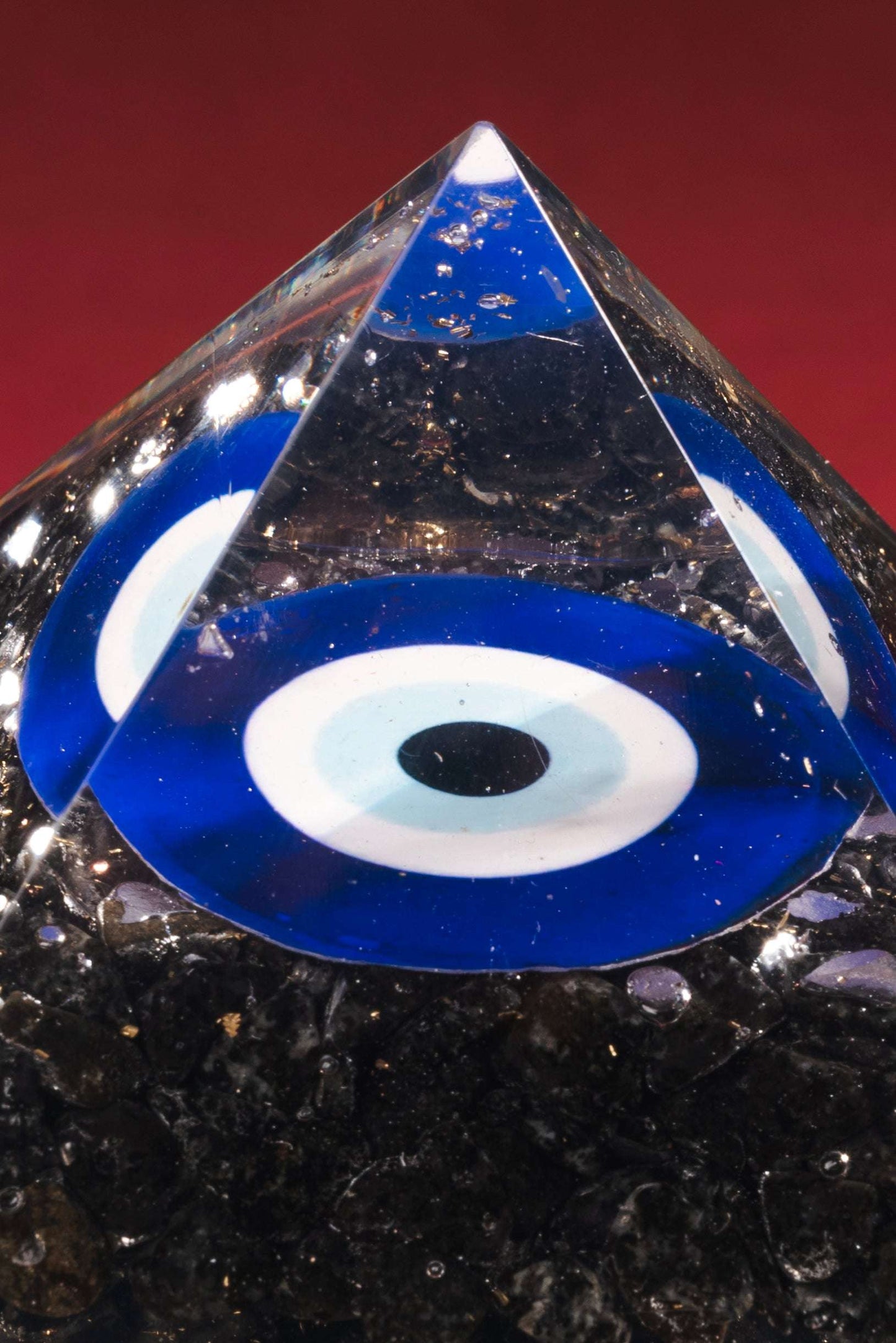 Blue evil eye crystal pyramid for space protection and peace