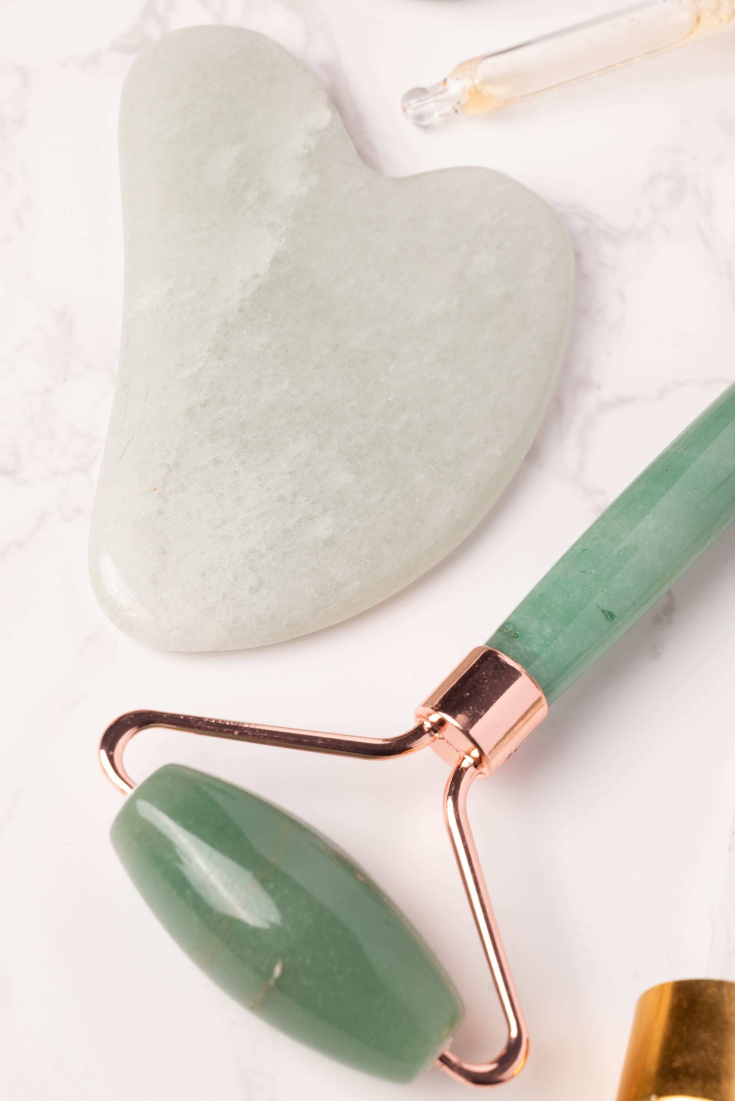 Crystal face roller and gua sha for skin firming and soothing energy