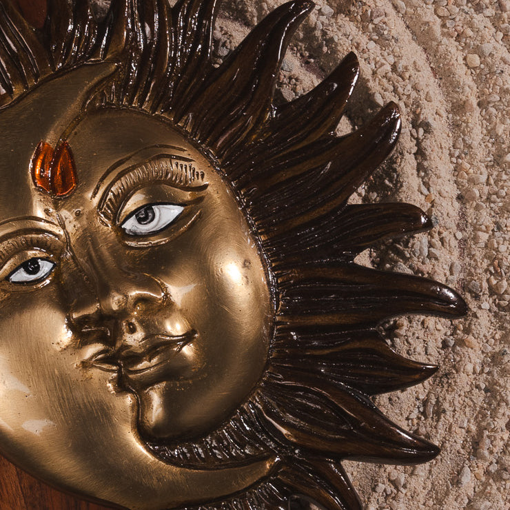 Spiritual brass décor symbolizing Surya and Chandra for couple harmony