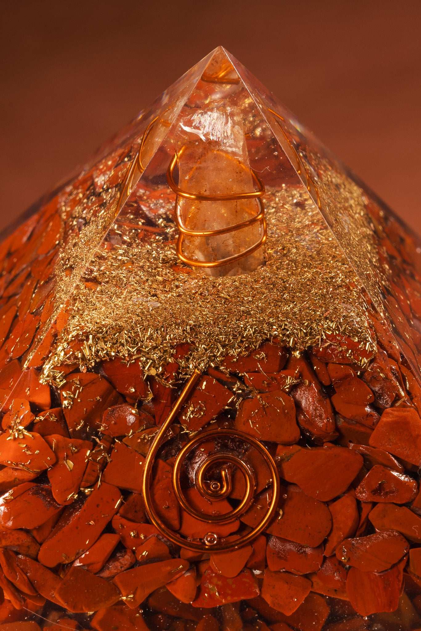 Orgonite pyramid with red jasper crystal and copper coil for root chakra