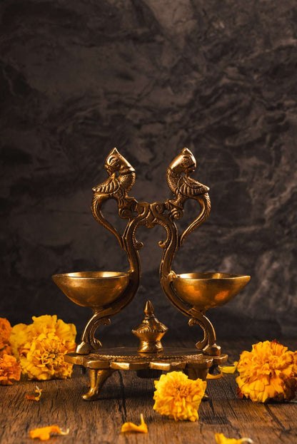 Dual brass peacock diya for auspicious lighting and spiritual decor