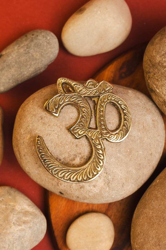 Brass Om wall hanging for spiritual energy and peace