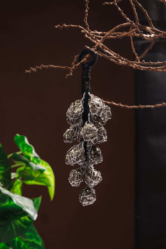 	Pyrite crystal hanging for abundance, protection, and Vastu correction