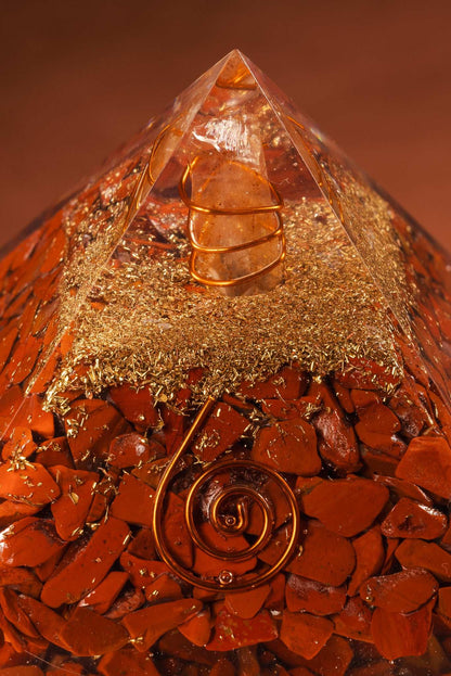 Orgonite pyramid with red jasper crystal and copper coil for root chakra